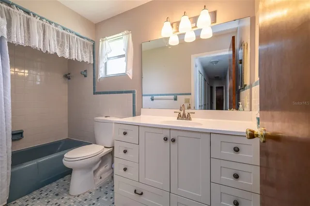 a utility room with sink dryer and washer