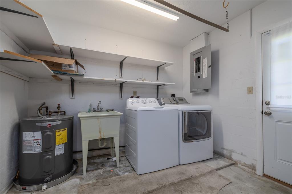 901 Duncan Road South Daytona, FL 32119 - Photo 16 of 22 a utility room with sink dryer and washer