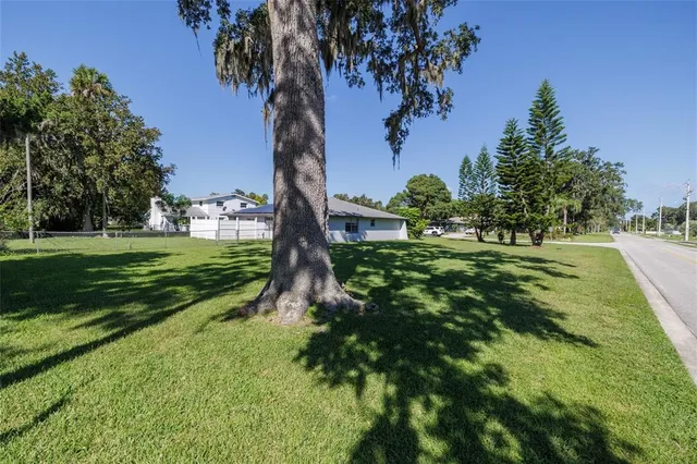 a view of a house with a big yard
