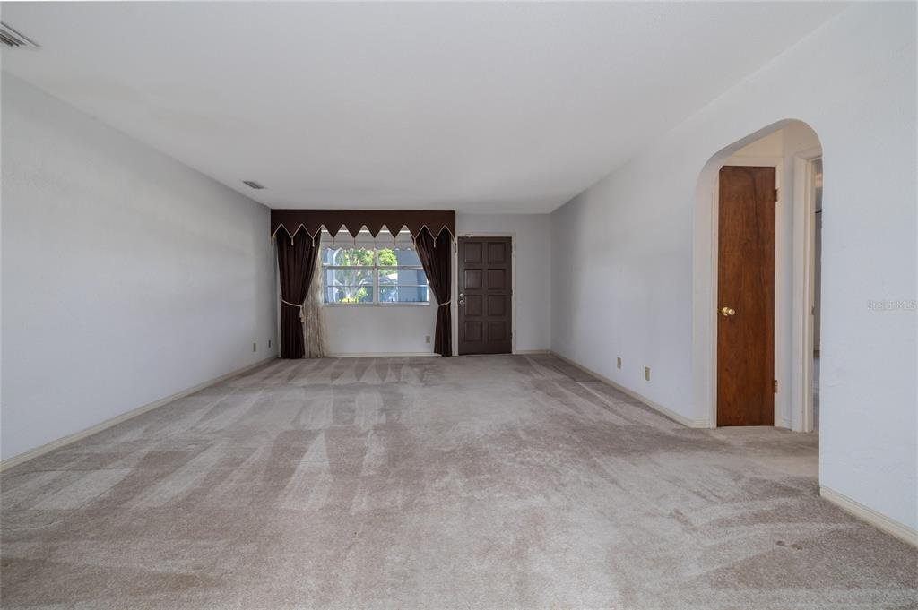 901 Duncan Road South Daytona, FL 32119 - Photo 3 of 22 an empty room with windows