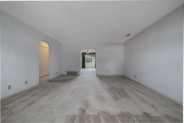 a view of an empty room and window