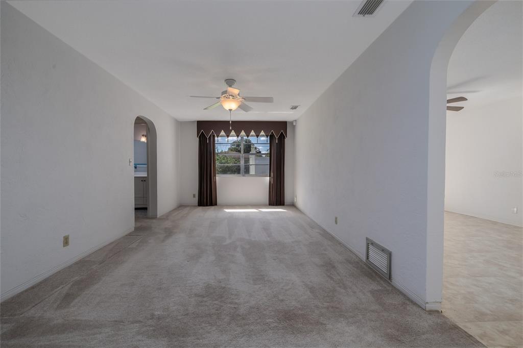 901 Duncan Road South Daytona, FL 32119 - Photo 5 of 22 a view of an empty room and window