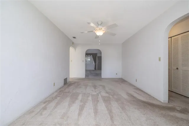 a view of an empty room with a bathroom