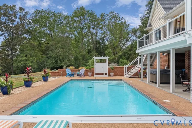 swimming pool view with seating space