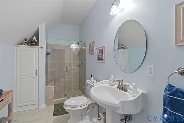 a bathroom with a sink toilet and a mirror