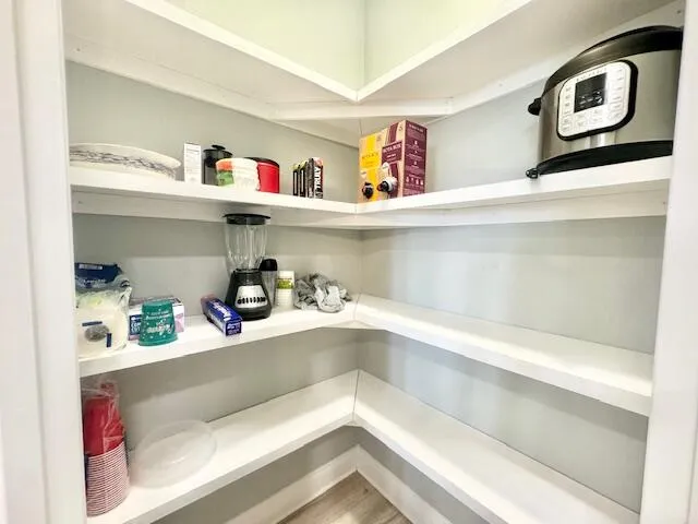 a cabinet with storage and utility