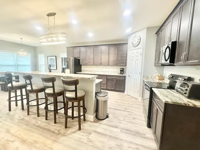 a kitchen with lots of counter top space and appliances