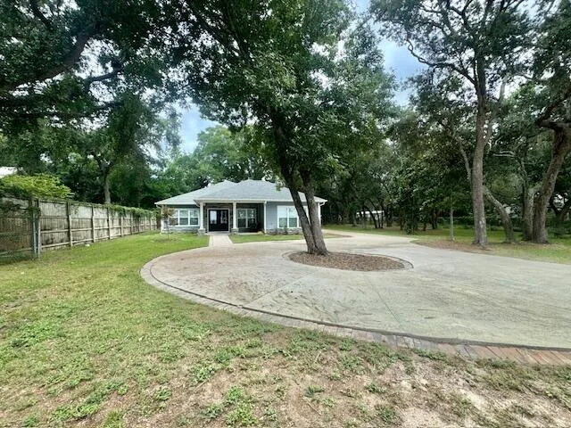 a house with trees in the background