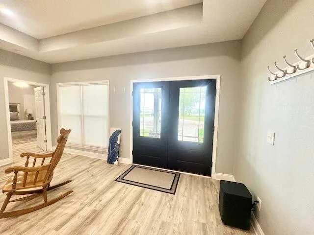 a bedroom with a bed a table and chair