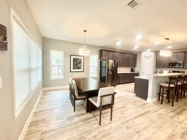 a view of a dining room with furniture