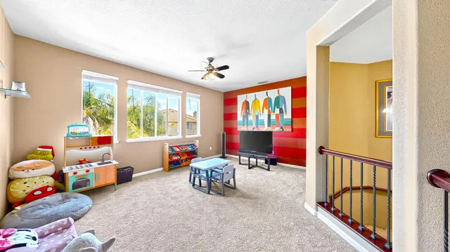 a room with furniture toys and a window