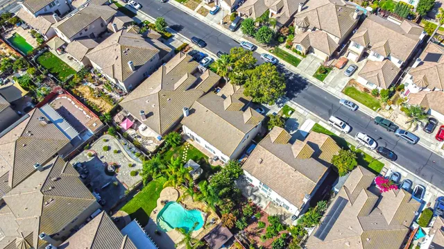 an aerial view of a house with a yard and garden