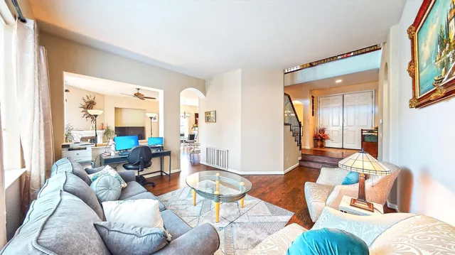 a living room with furniture and a large window