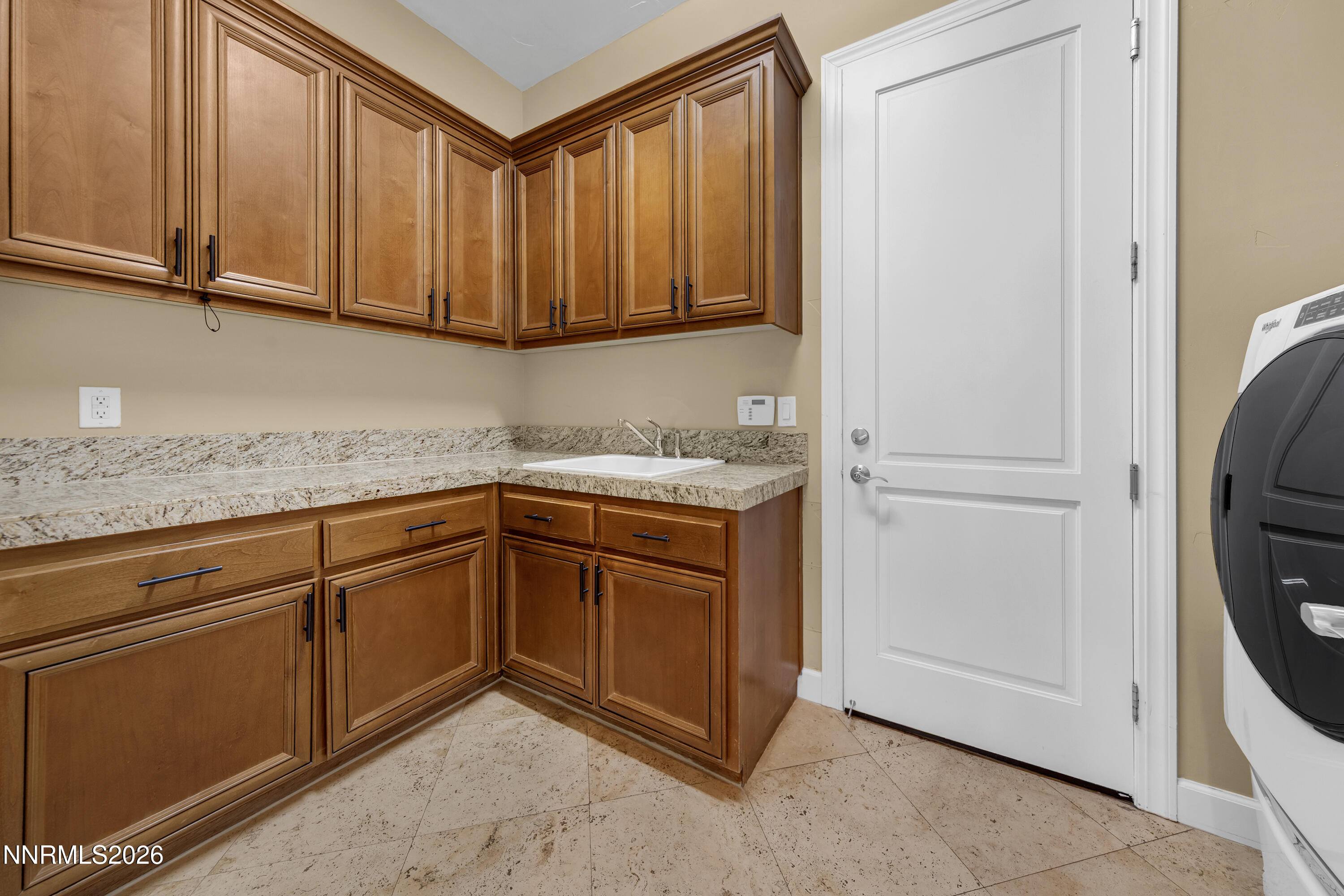 1898 Laurel Ridge Drive Reno, NV 89523 - Photo 64 of 87 a kitchen with stainless steel appliances granite countertop a sink and a refrigerator