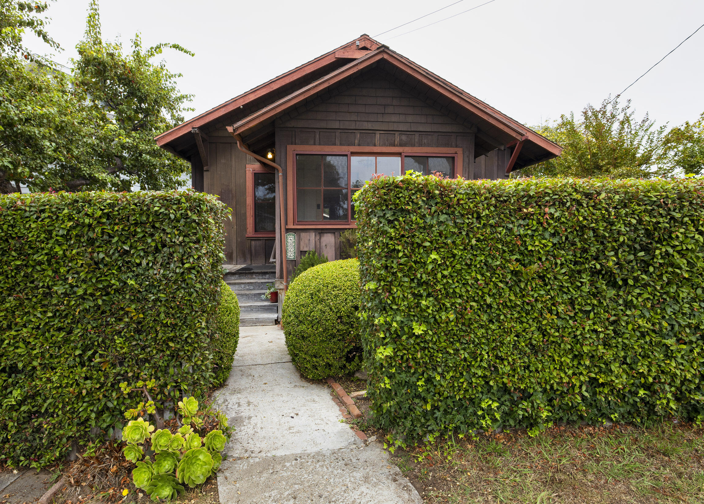 a view of a pathway in front of house