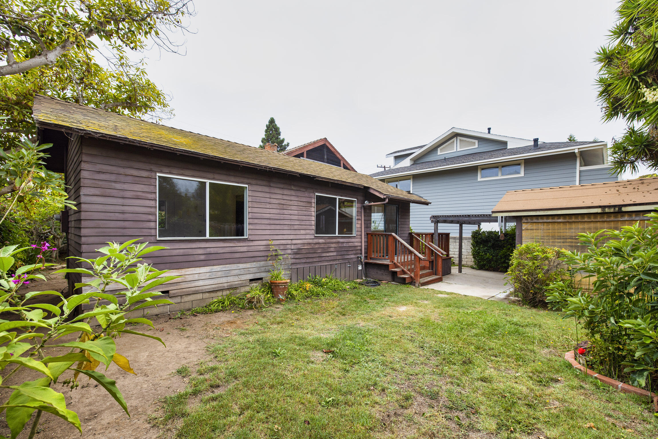 4822 9th Street Carpinteria, CA 93013 - Photo 19 of 22 a view of a house with backyard sitting area and garden