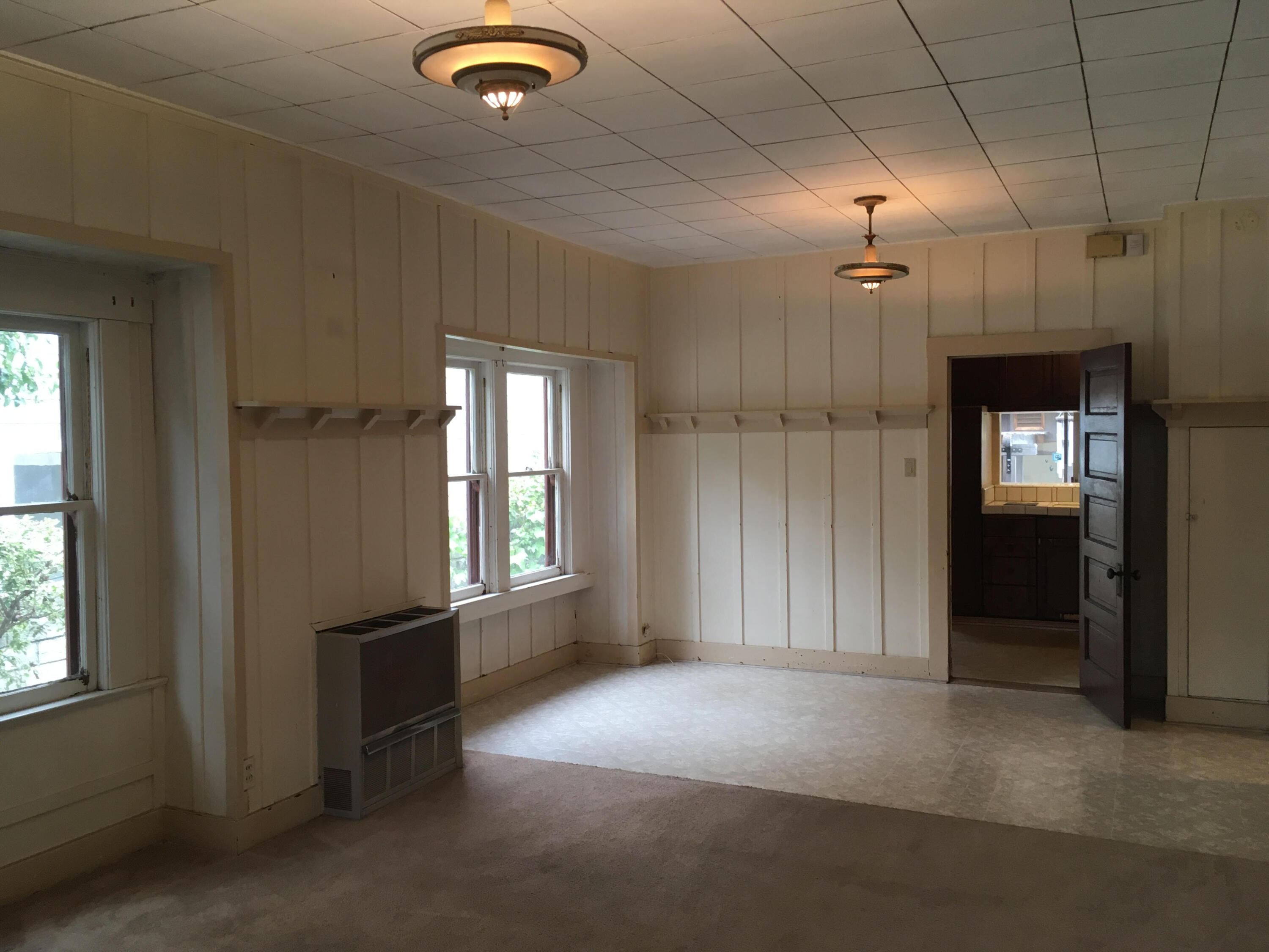 4822 9th Street Carpinteria, CA 93013 - Photo 8 of 22 an empty room with windows and entrance