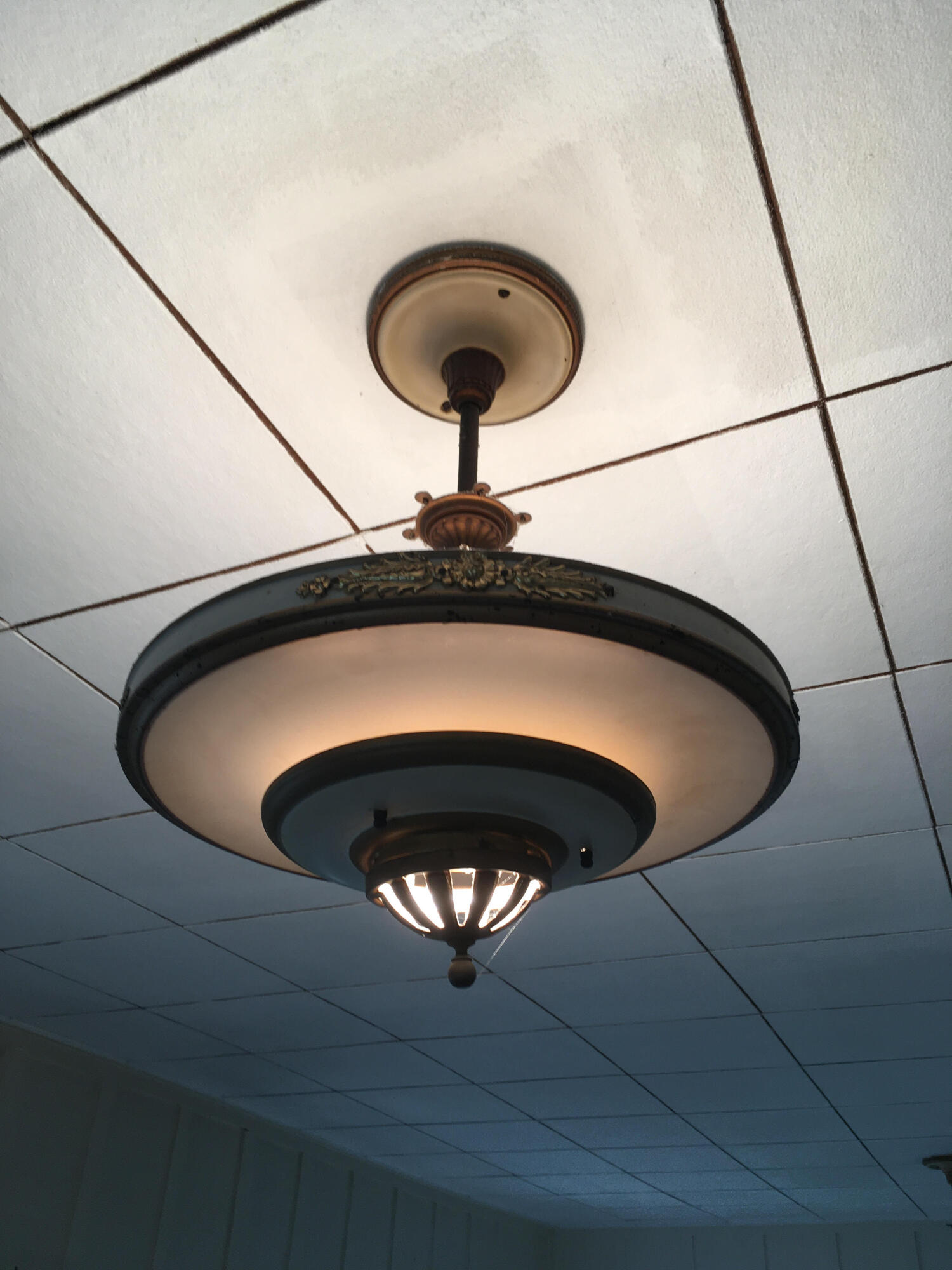 4822 9th Street Carpinteria, CA 93013 - Photo 9 of 22 a close view of kitchen island with a sink and a chandelier