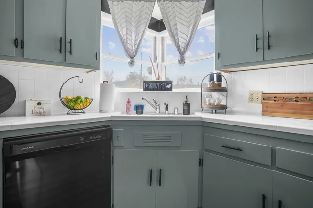 a kitchen with a sink and a cabinets