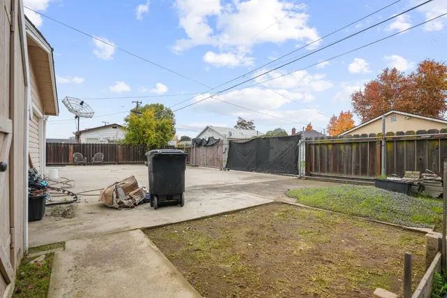 a view of a backyard with sitting area