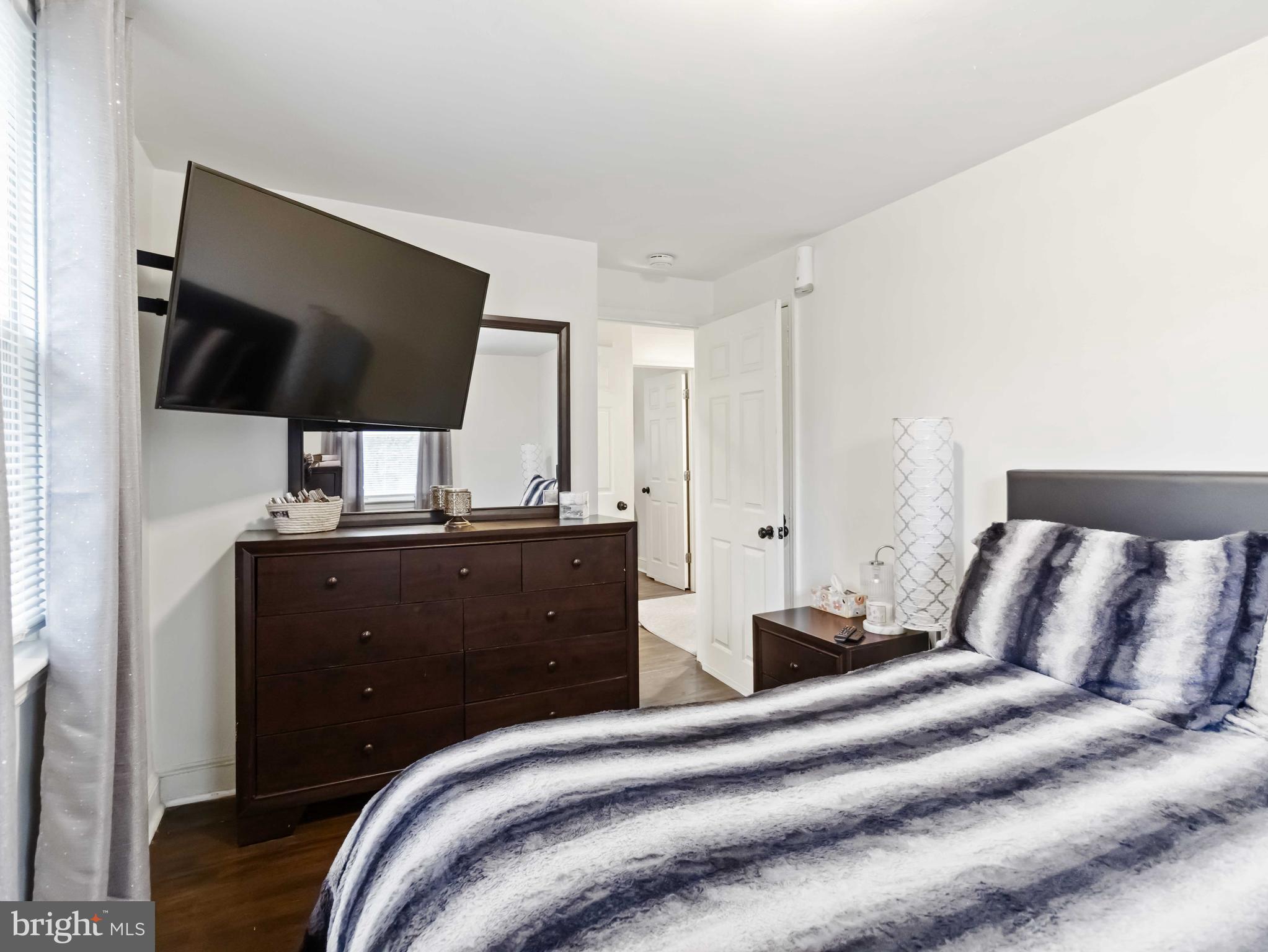 1008 Springfield Road Collingdale, PA 19023 - Photo 36 of 48 a bedroom with a bed and a flat screen tv