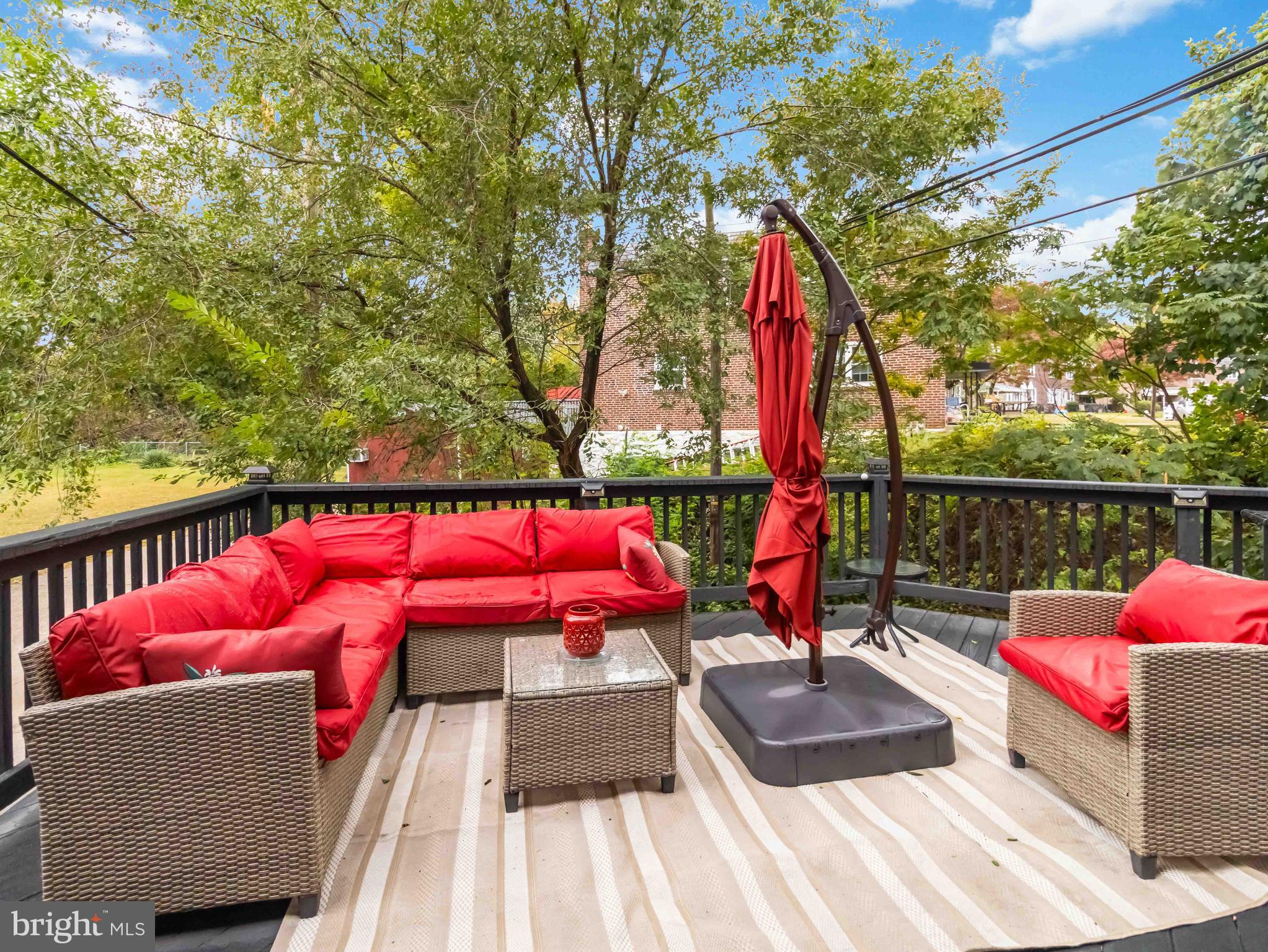 1008 Springfield Road Collingdale, PA 19023 - Photo 45 of 48 a view of swimming pool with red chairs and fire pit