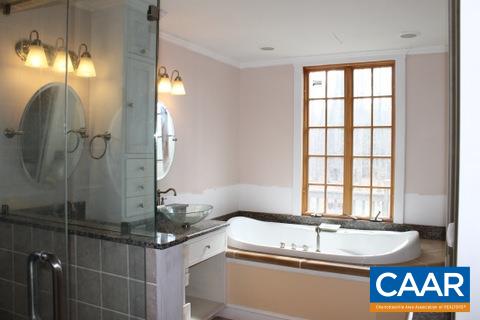 4375 Sharon Road Esmont, VA 22937 - Photo 27 of 37 a bathroom with a granite countertop sink and a mirror