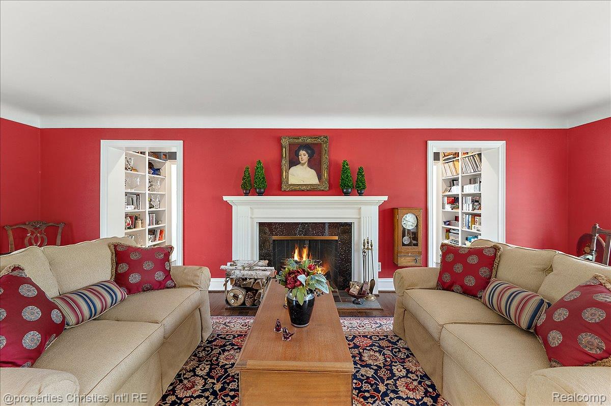 135 Clifton Road Bloomfield Hills, MI 48301 - Photo 8 of 77 Living area featuring a fireplace with a white mantel and dark stone surround