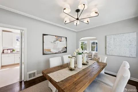a view of a dining room with furniture window and wooden floor