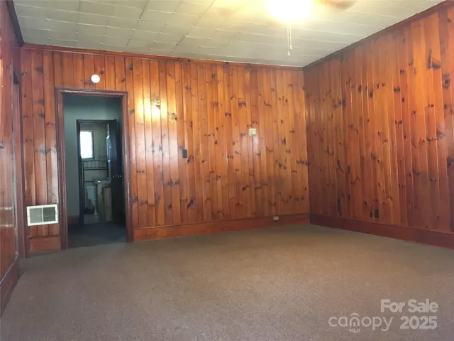 a white refrigerator freezer sitting next to a white wall