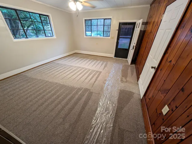a view of an empty room with a window