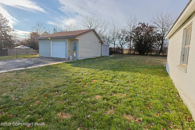a backyard of a house with lots of green space
