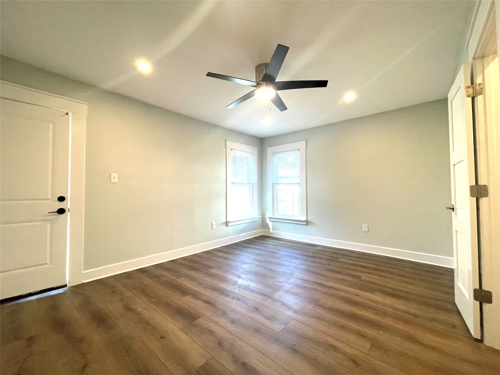 807 East Riverside Drive, Unit A Austin, TX 78704 - Photo 20 of 29 Dark wood finished floors, a ceiling fan, and recessed lighting