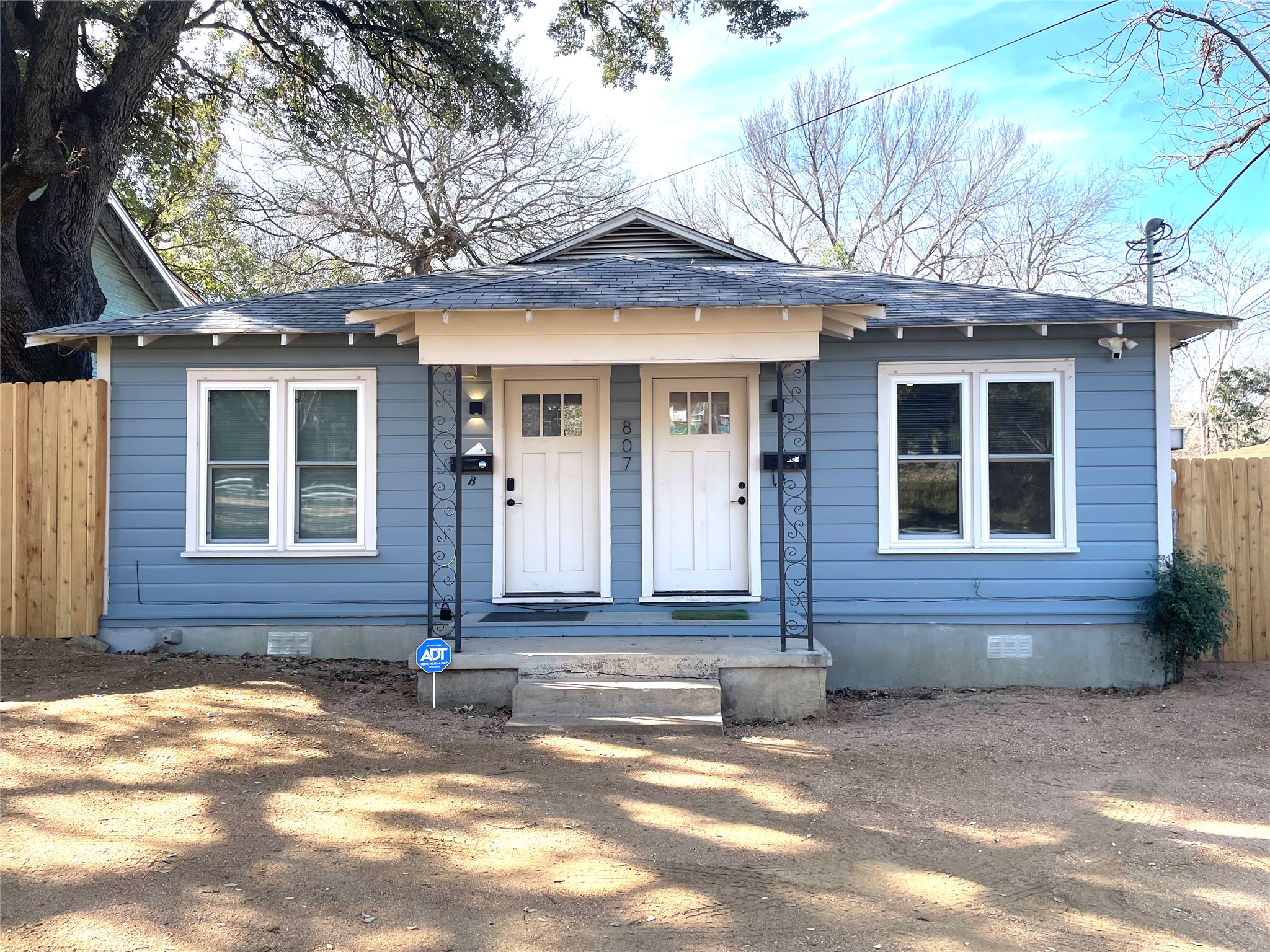 807 East Riverside Drive, Unit A Austin, TX 78704 - Photo 2 of 29 View of front facade with crawl space, a shingled roof, and covered porch