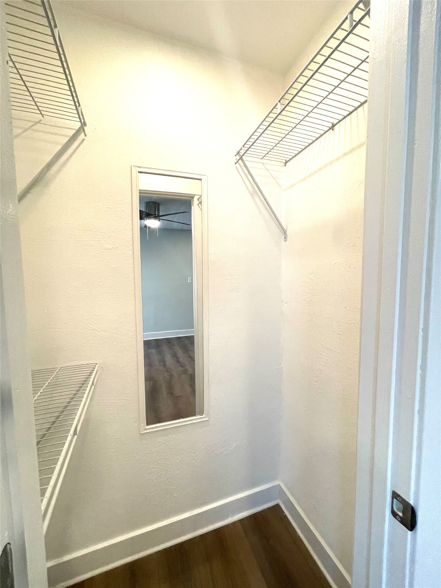 807 East Riverside Drive, Unit A Austin, TX 78704 - Photo 23 of 29 Walk in closet featuring dark wood-style floors