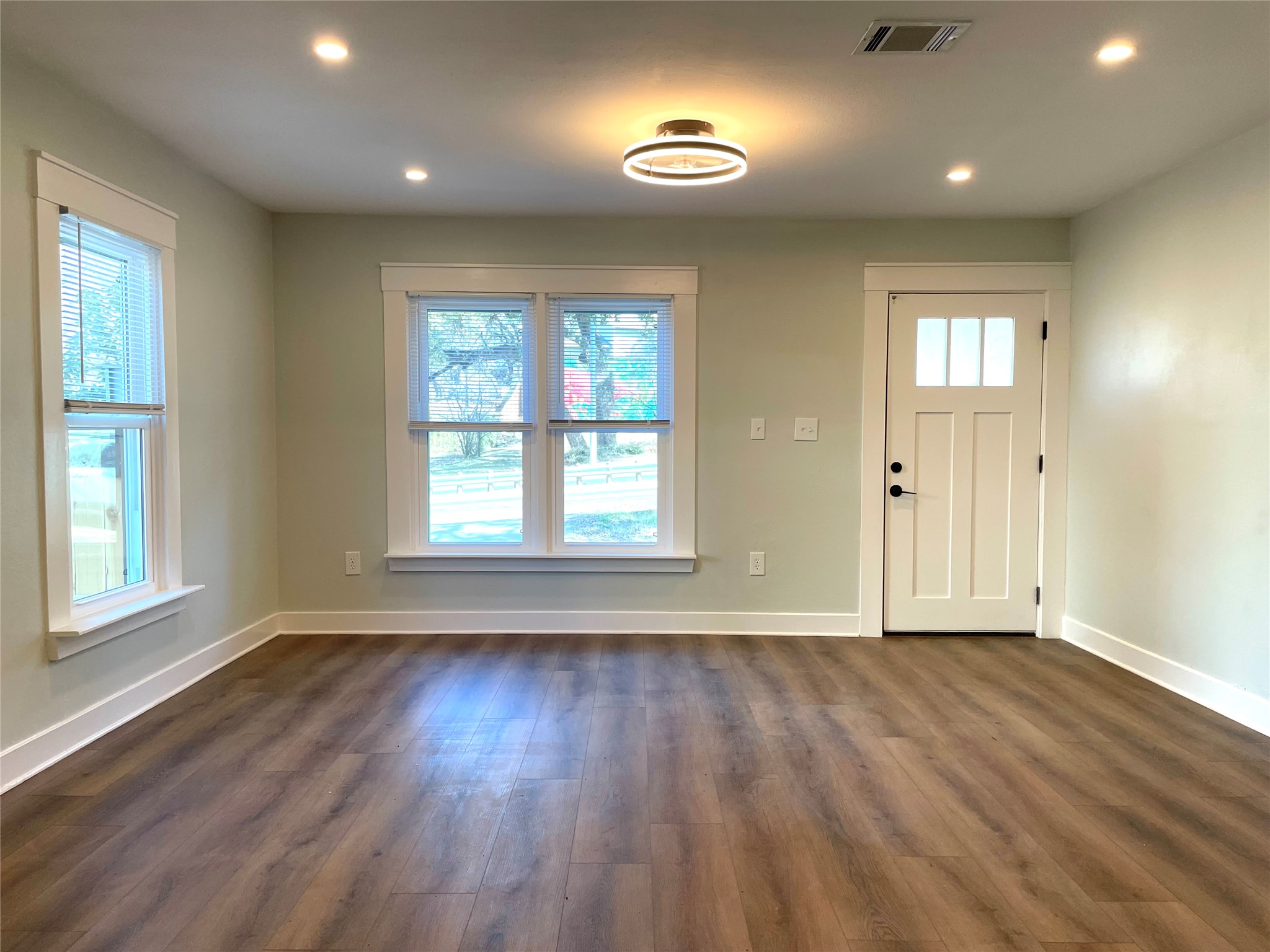 807 East Riverside Drive, Unit A Austin, TX 78704 - Photo 4 of 29 Entrance foyer with dark wood-style floors and recessed lighting