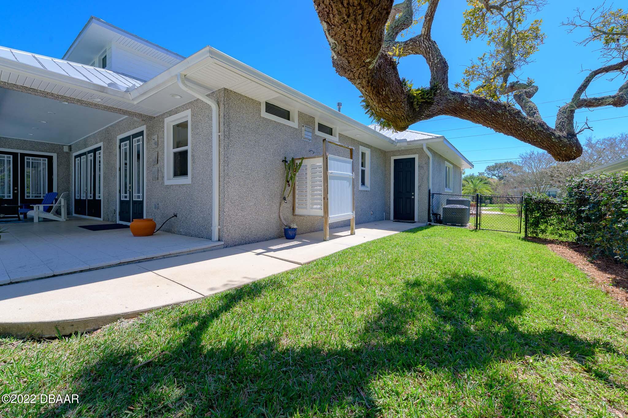 113 Neptune Avenue Ormond Beach, FL 32176 - Photo 18 of 70 West Wrap around Porch w/ shower!