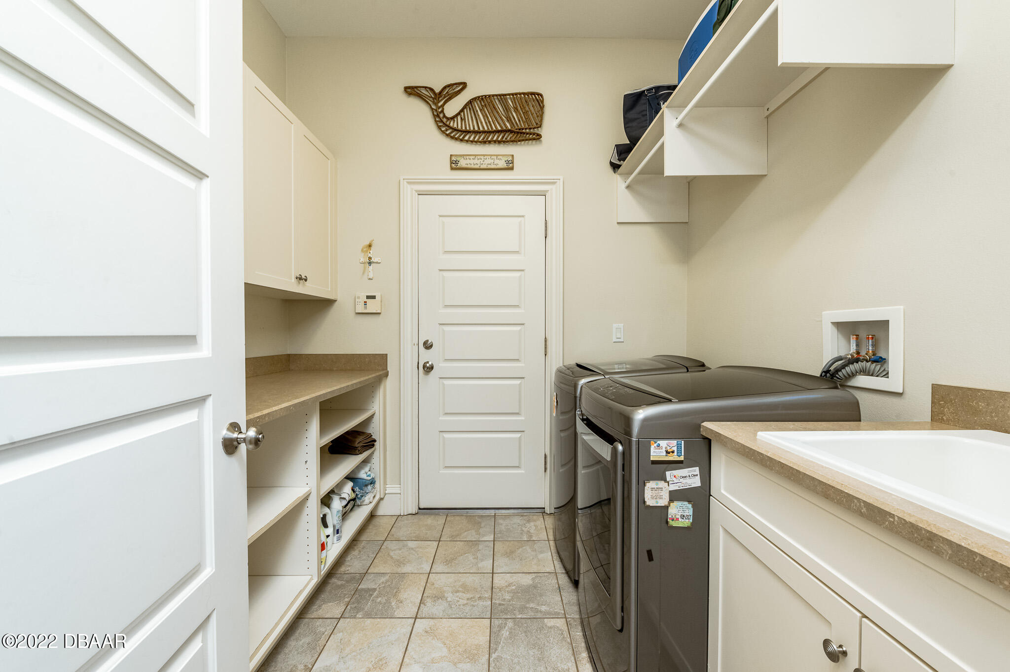 113 Neptune Avenue Ormond Beach, FL 32176 - Photo 38 of 70 Laundry off the kitchen