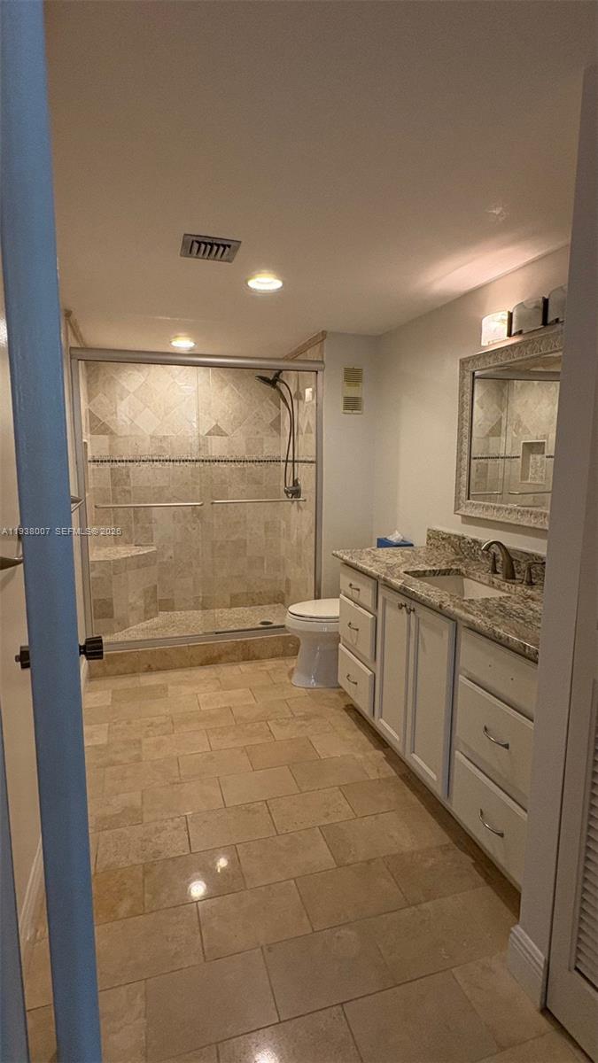 6300 Northwest 2nd Avenue, Unit 403 Boca Raton, FL 33487 - Photo 13 of 20 a bathroom with a sink a toilet and shower