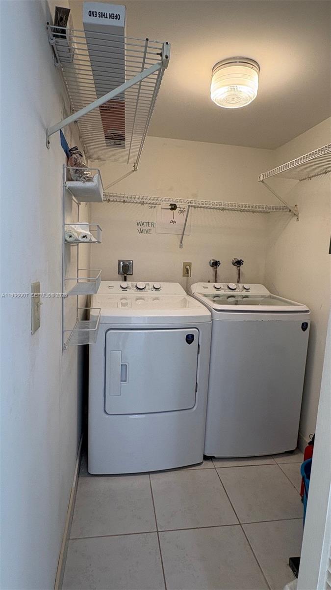 6300 Northwest 2nd Avenue, Unit 403 Boca Raton, FL 33487 - Photo 8 of 20 a utility room with dryer and washer