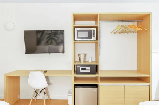 a room with a lamp and a table in it