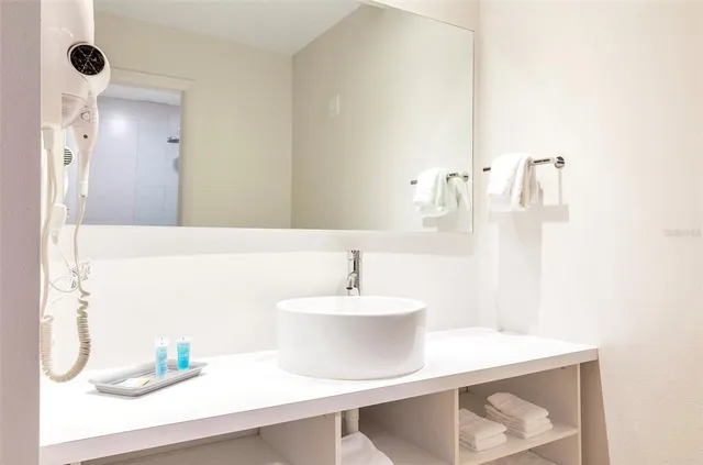 a bathroom with a sink and a mirror