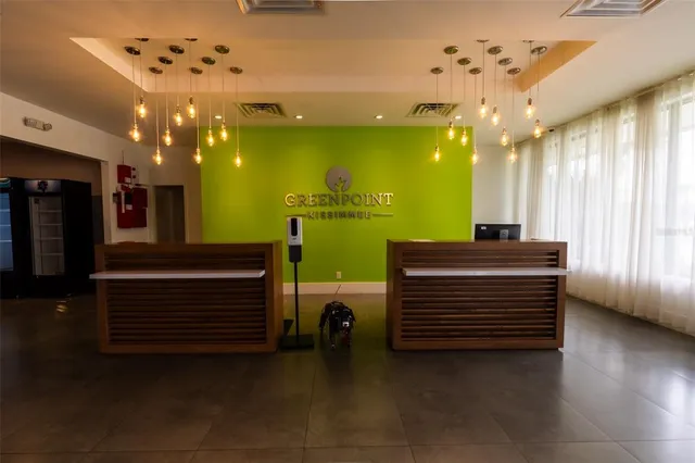 a room with stairs and a chandelier