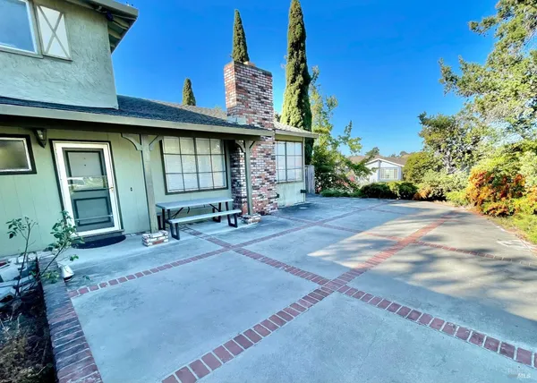 a view of a house with a backyard