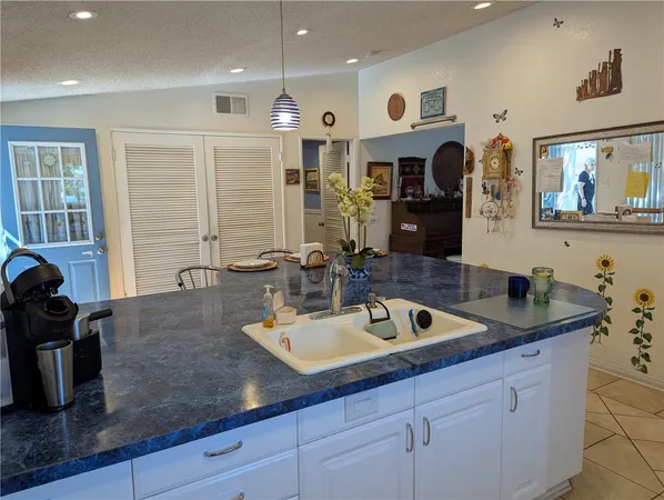 a bathroom with a sink double vanity granite and a mirror