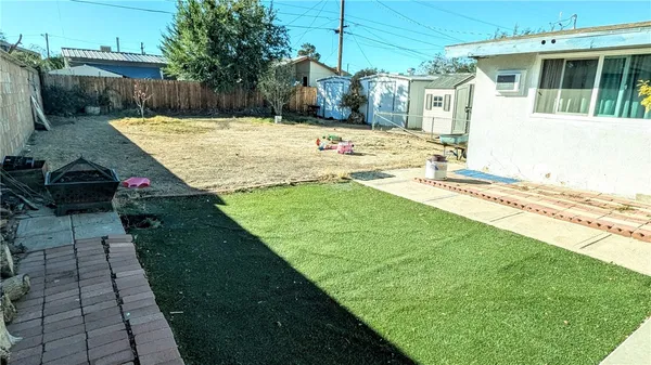 a view of a backyard that has a fountain
