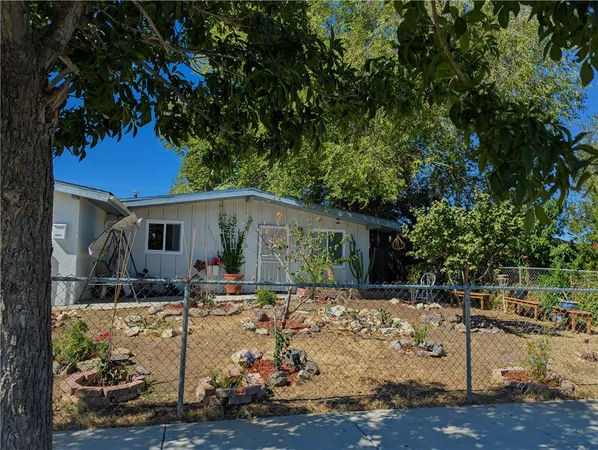 a front view of a house with yard