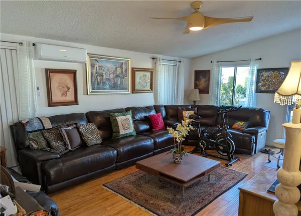 a living room with furniture and a window