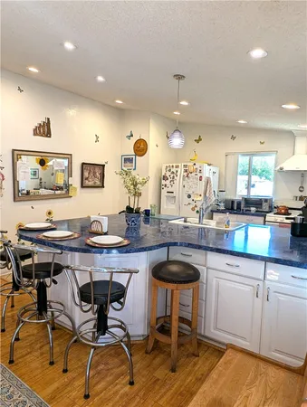 a kitchen with a table and chairs in it
