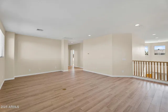 a bathroom with a granite countertop sink a mirror and a shower